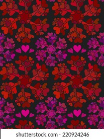 Red and purple circle patterns based on swirls and hearts making a seamless pattern on a dark background