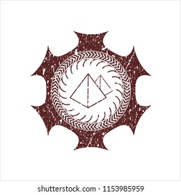 Red pyramids icon inside distress grunge style stamp