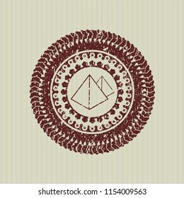 Red pyramids icon inside distressed rubber stamp with grunge texture