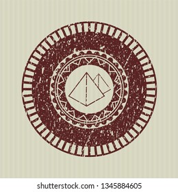 Red pyramids icon inside grunge seal