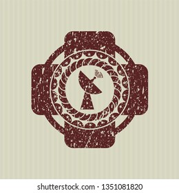 Red radar icon inside distressed rubber grunge texture seal