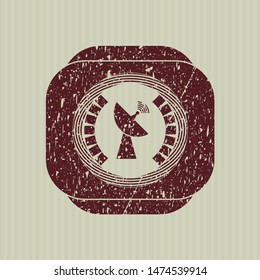 Red radar icon inside distressed rubber grunge texture seal