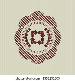 Red recycle icon inside distress grunge style stamp