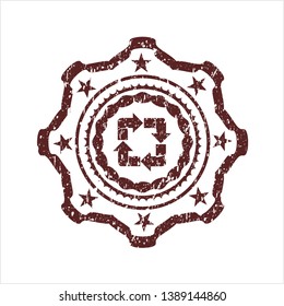 Red recycle icon inside distress rubber seal