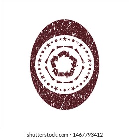 Red recycle icon inside distress rubber texture