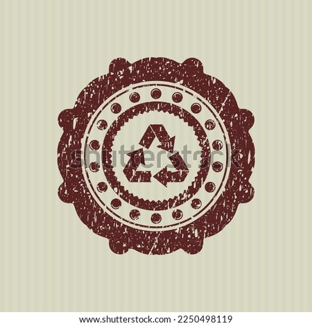 Red recycle icon inside distress rubber grunge seal. 