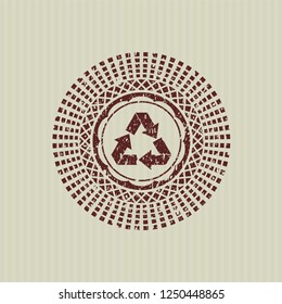 Red recycle icon inside distressed grunge stamp