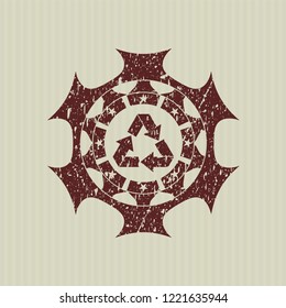 Red recycle icon inside rubber grunge stamp