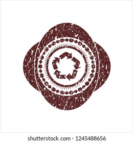 Red recycle icon inside rubber stamp