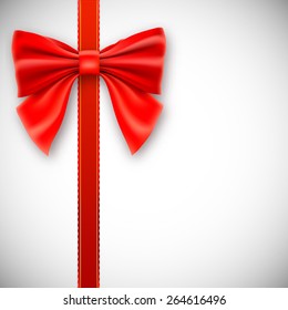Red ribbon with bow, isolated on white background.