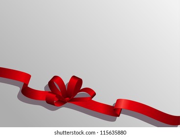 red ribbon with a bow on a gray background