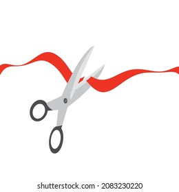 Red ribbon cut with scissors isolated on white background
