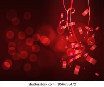 red ribbon falling with red bokeh background