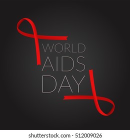 Red ribbon on dark background. World AIDS Day symbol