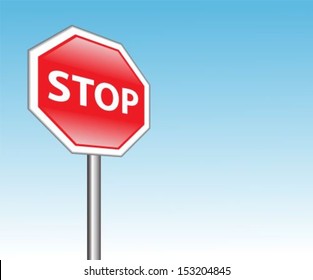 red road sign "stop" on a background of blue sky