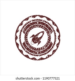 Red rocket icon inside distress rubber grunge texture stamp