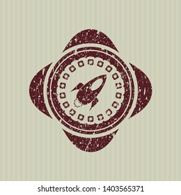 Red rocket icon inside distressed grunge style stamp