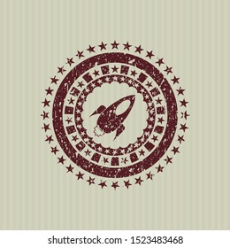 Red rocket icon inside distressed grunge style stamp