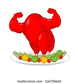 Red rooster strong on plate with vegetables. Red cock Symbol of new year. Powerful baked turkey with big biceps. Game bodybuilder. Fitness food for holiday. Sports fried chicken