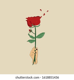 red rose with a hand-held decoration and a vintage background