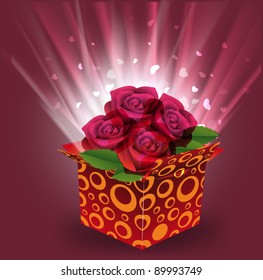 Rosas rojas en caja de regalo