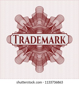 Red rosette or money style emblem with text Trademark inside