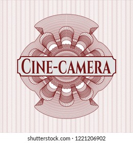 Red rosette (money style emblem) with text Cine-camera inside