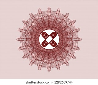Red rosette or money style emblem with crossed bandage plaster icon inside