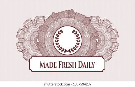 Red rosette or money style emblem with leaf crown icon and Made Fresh Daily text inside