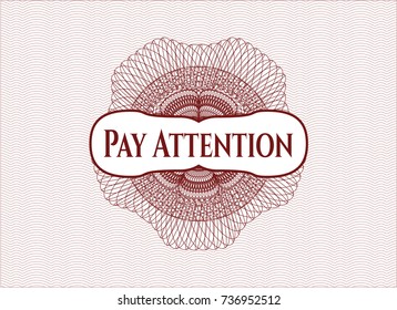 Red rosette or money style emblem with text Pay Attention inside