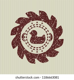 Red rubber duck icon inside distressed rubber texture