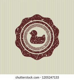 Red rubber duck icon inside rubber grunge texture stamp