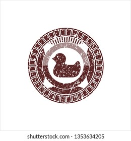 Red rubber duck icon inside rubber stamp with grunge texture