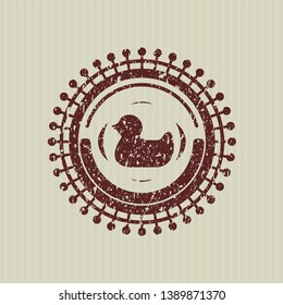 Red rubber duck icon inside distressed grunge stamp