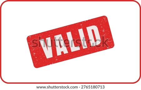 Red rubber stamp with the word VALID imprinted on a white background