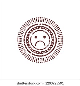 Red sad face icon inside distress rubber grunge texture stamp