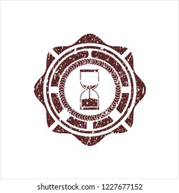Red sand clock icon inside distress with rubber seal texture