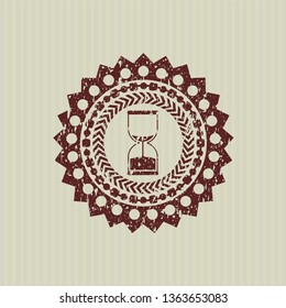 Red sand clock icon inside distressed rubber grunge texture stamp