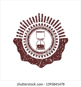 Red sand clock icon inside distressed rubber texture
