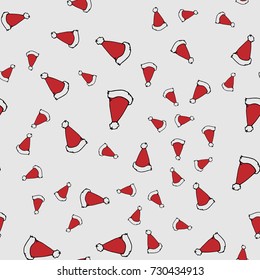 Red Santa hats. Seamless pattern. Hand drawn vector stock illustration