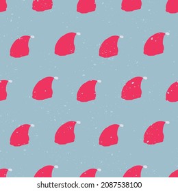 red santa hats seamless vector pattern on blue