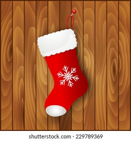 Red Santa's boot on wooden background