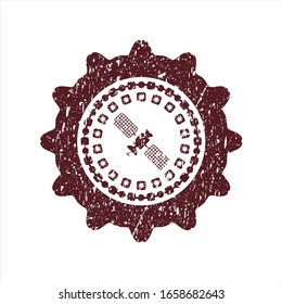Red satelite icon inside distress rubber grunge texture stamp