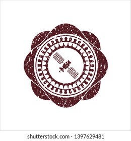 Red satelite icon inside distressed rubber seal
