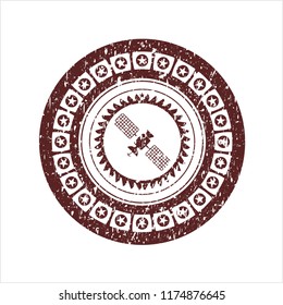 Red satelite icon inside rubber texture