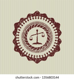 Red scale icon inside distress rubber stamp with grunge texture