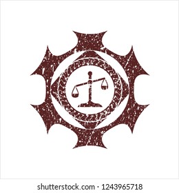 Red scale icon inside rubber stamp with grunge texture