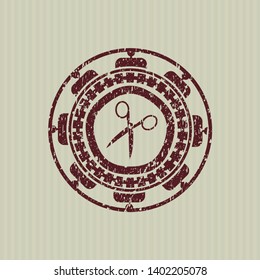Red scissors icon inside distress rubber seal