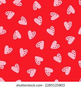 Patrón sin costuras rojas con corazones rosados