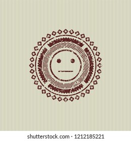 Red serious face icon inside rubber grunge texture stamp